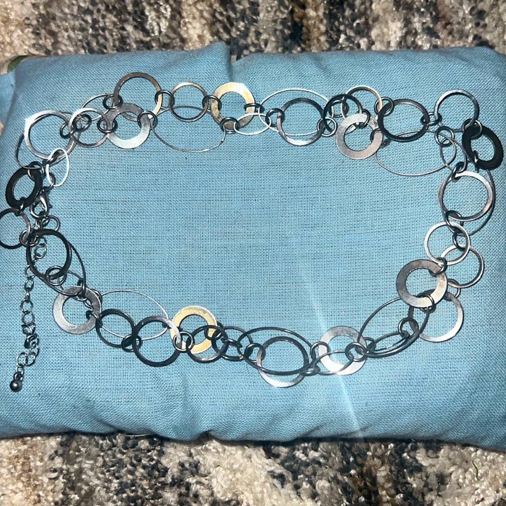 This is a silver tie around belt or waist jewelry.